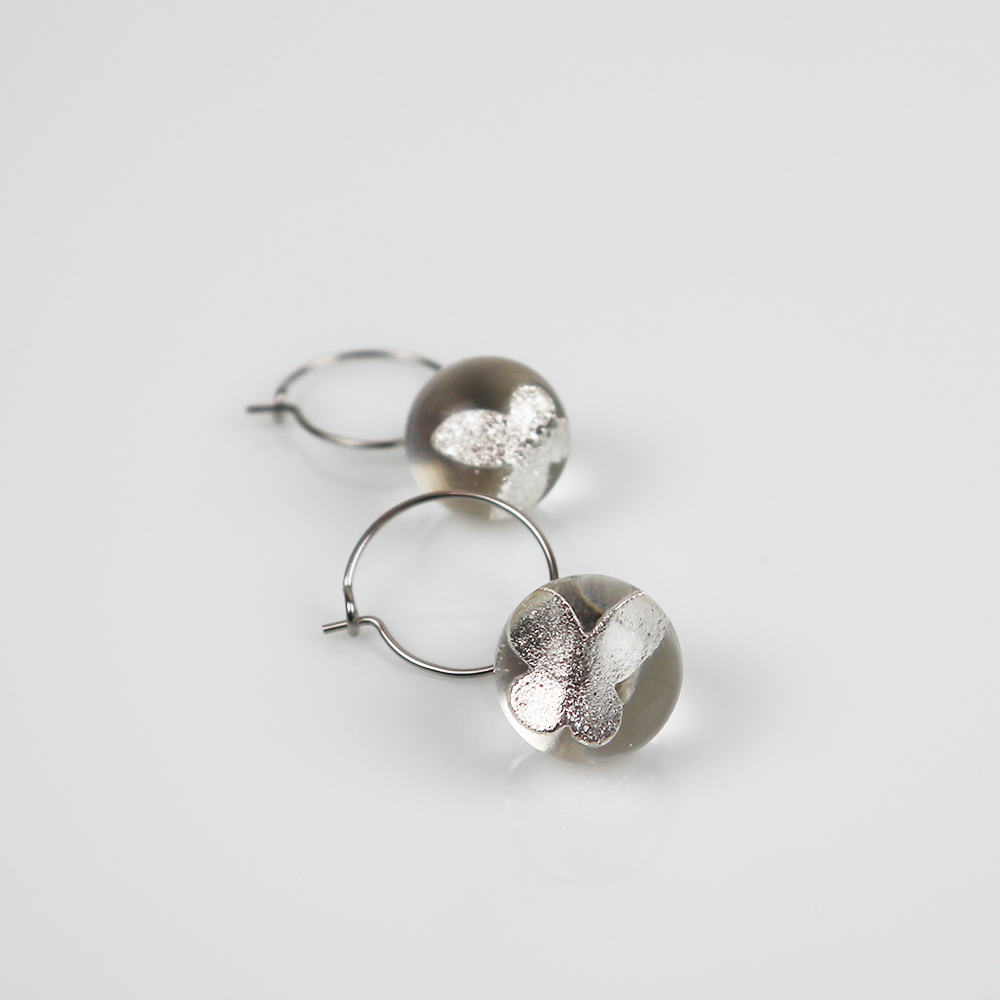 Pair of silver earrings with silver butterfly