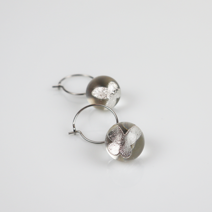 Pair of silver earrings with silver butterfly