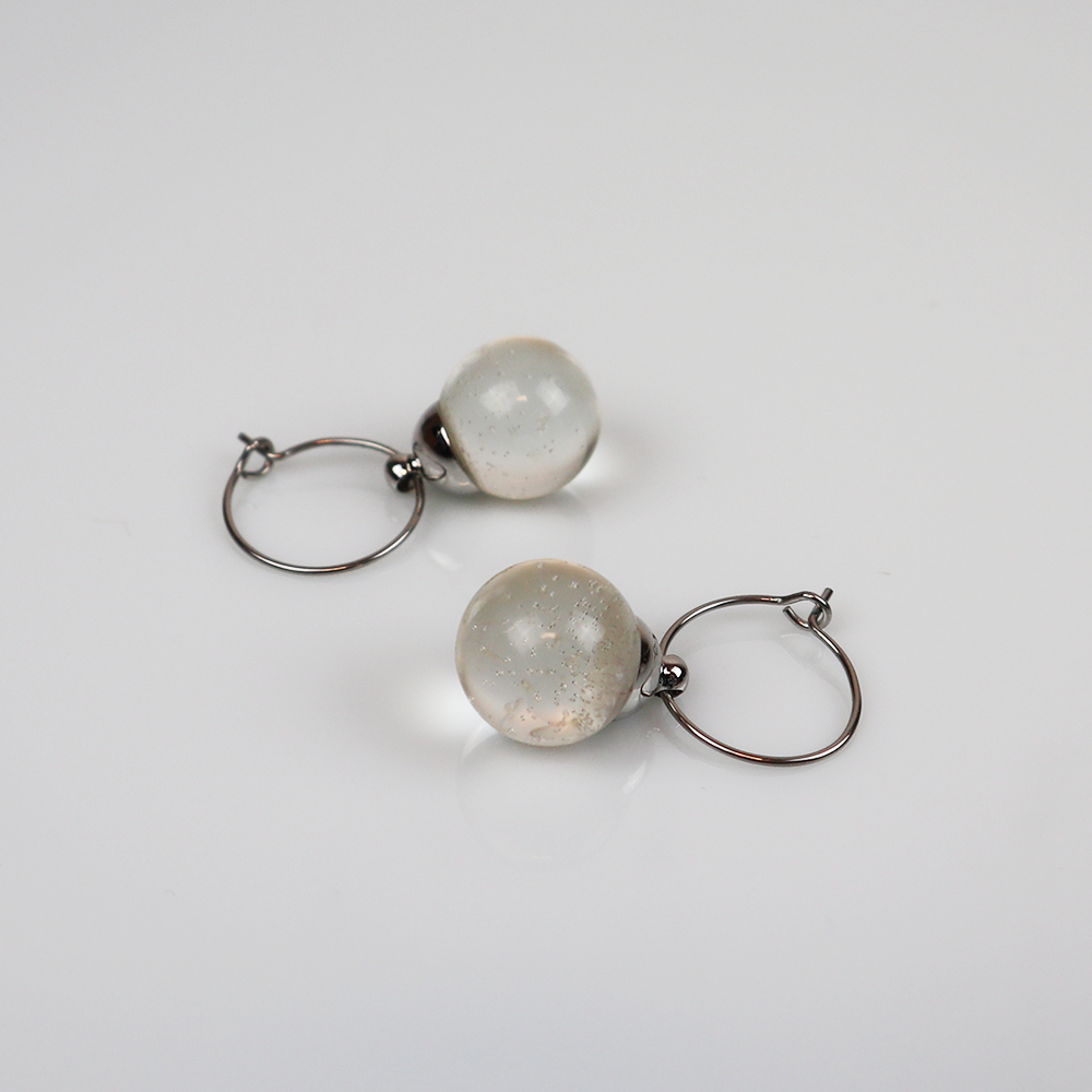 Pair of silver earrings with pure pendants